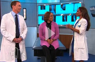 Doctors having conversation with patient